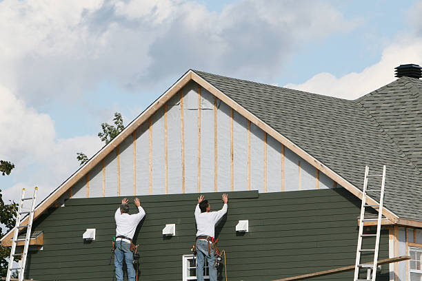 Professional Siding technician working in Newington, VA